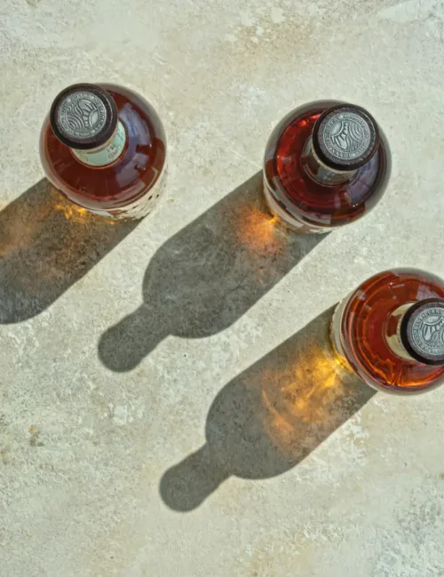 tops of three bottles from above