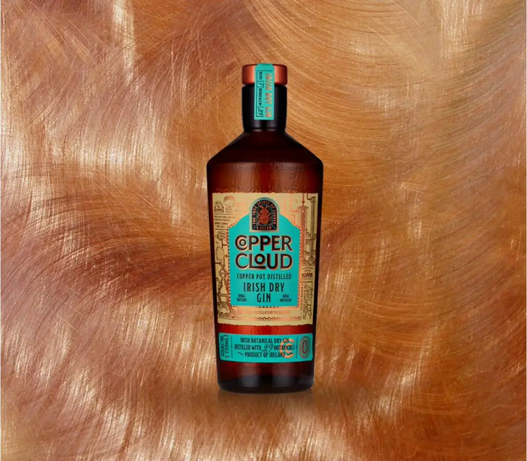 copper cloud gin bottle with brushed background