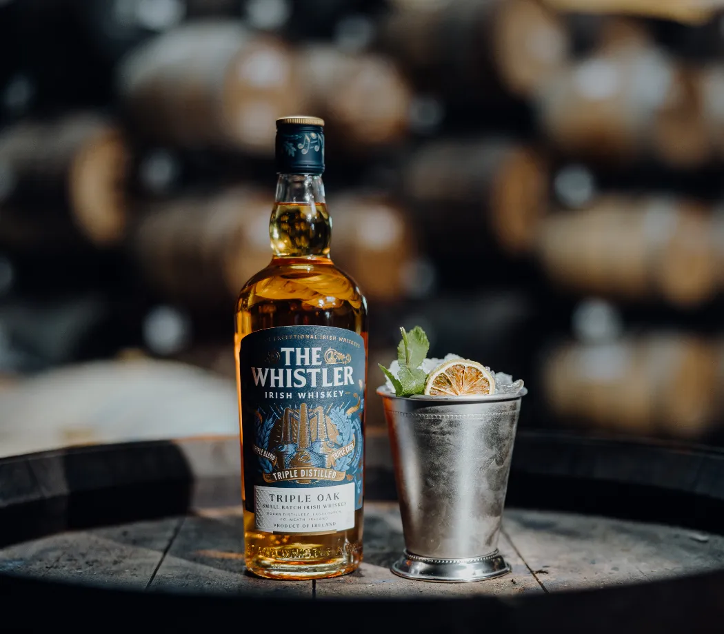 whistler bottle and cocktail on barrel